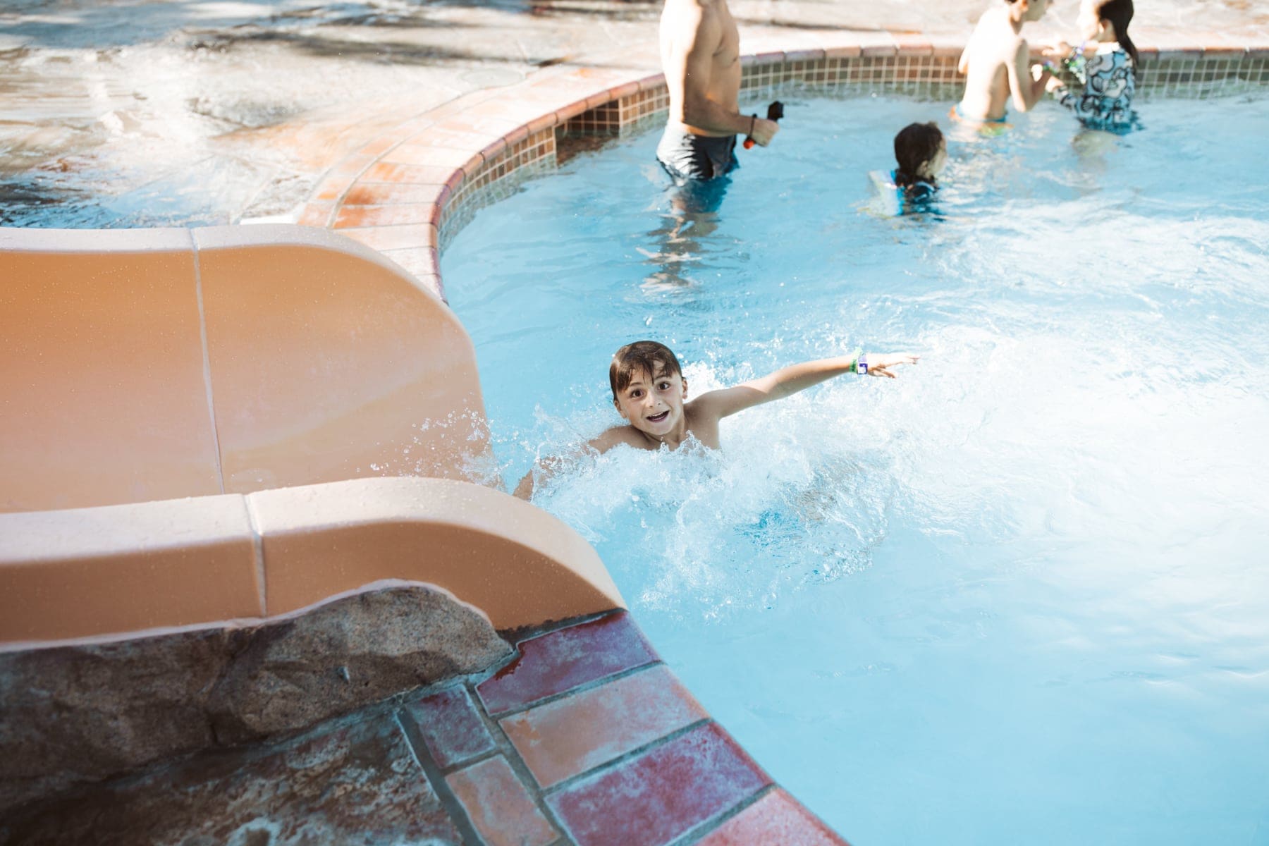 kids playing in the pool