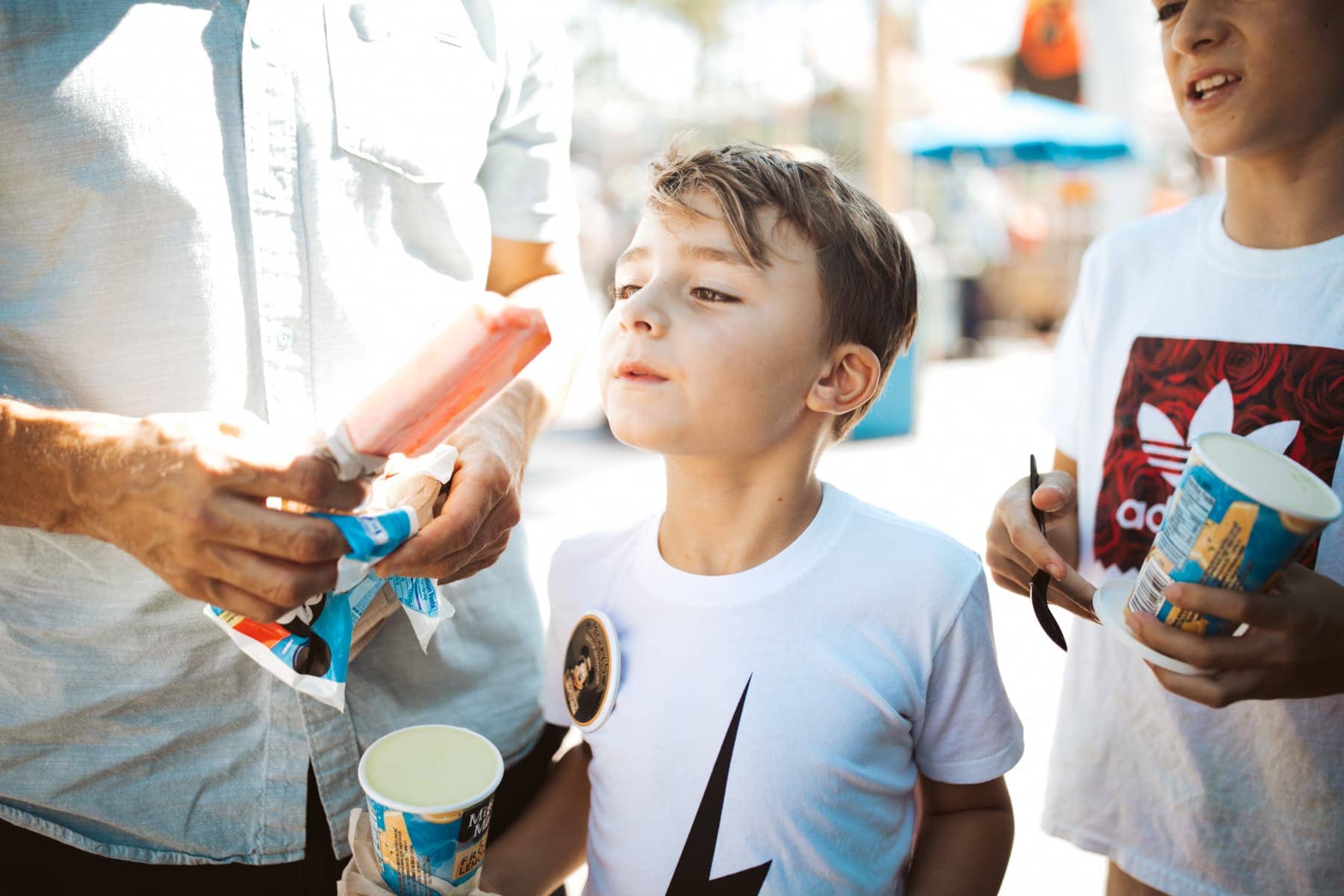 boy sharing popsicle