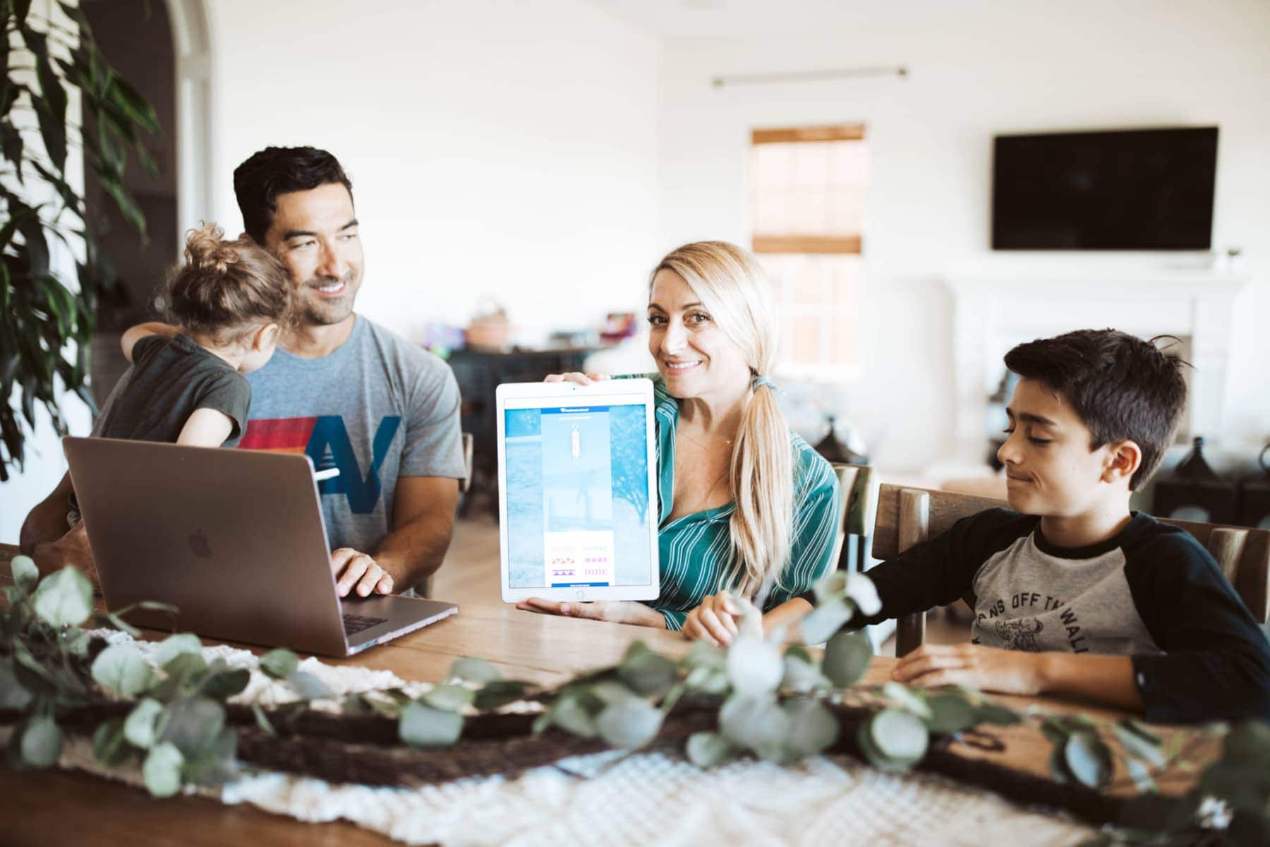 family at table on devices