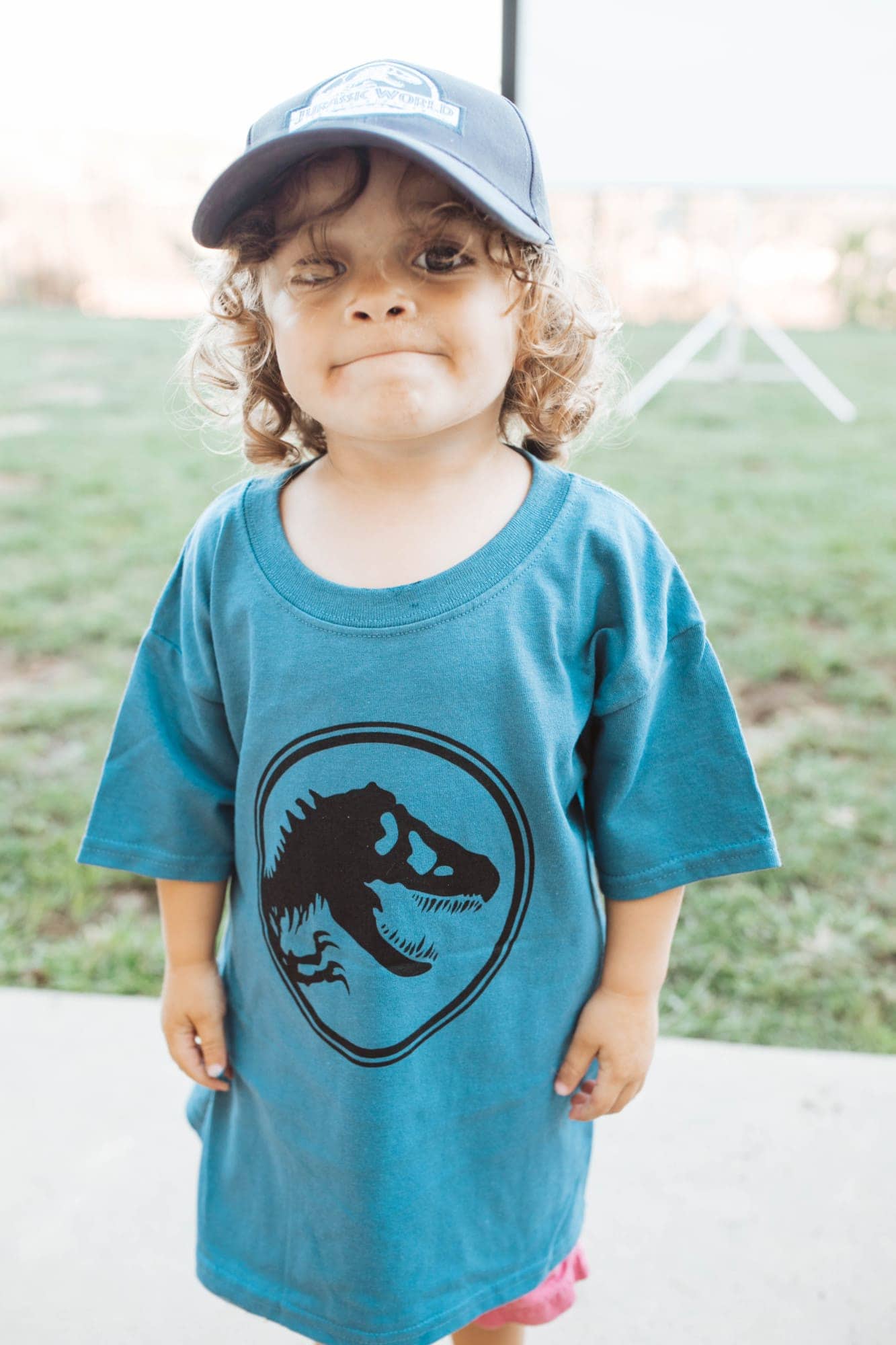 toddler in dinosaur tee