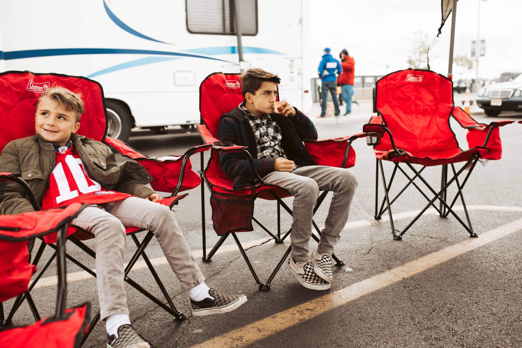 brothers sitting at tailgate 