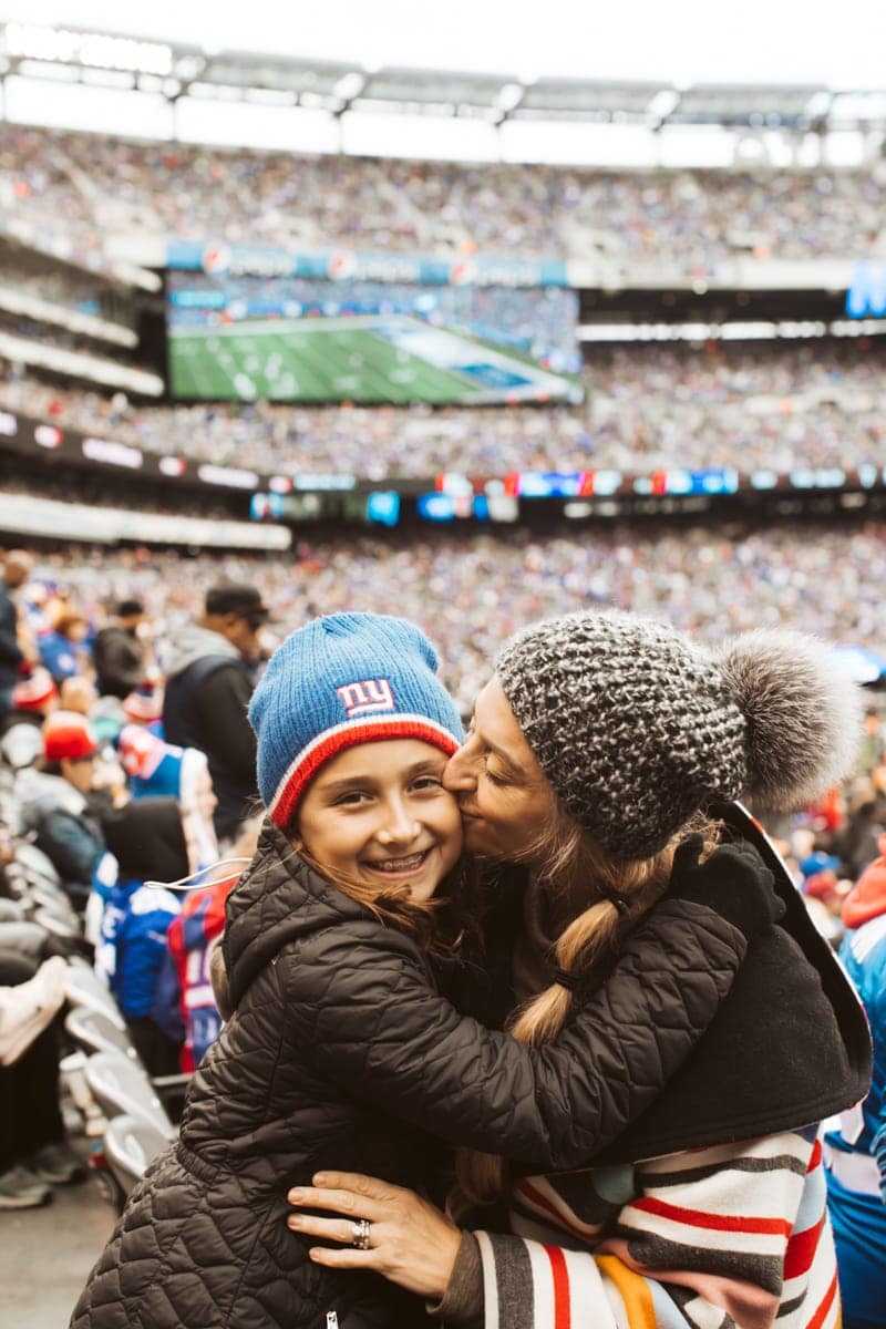 mom and daughter at football game 