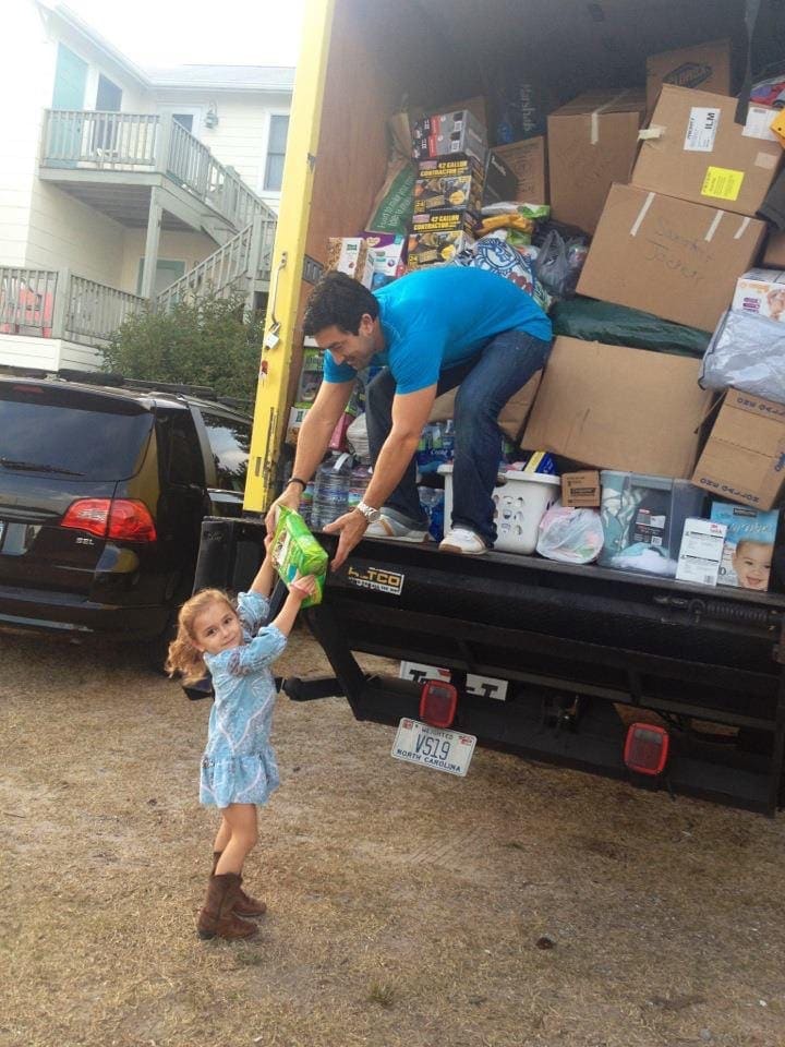 dad and daughter helping in hurricane