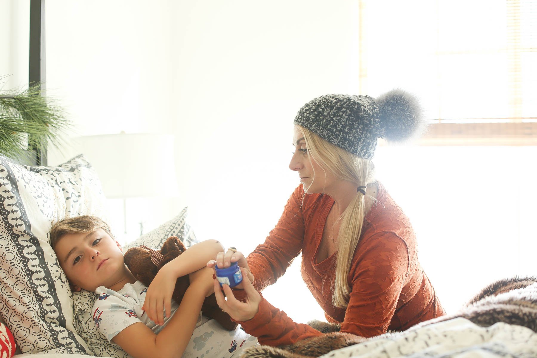 mom helping sick kid