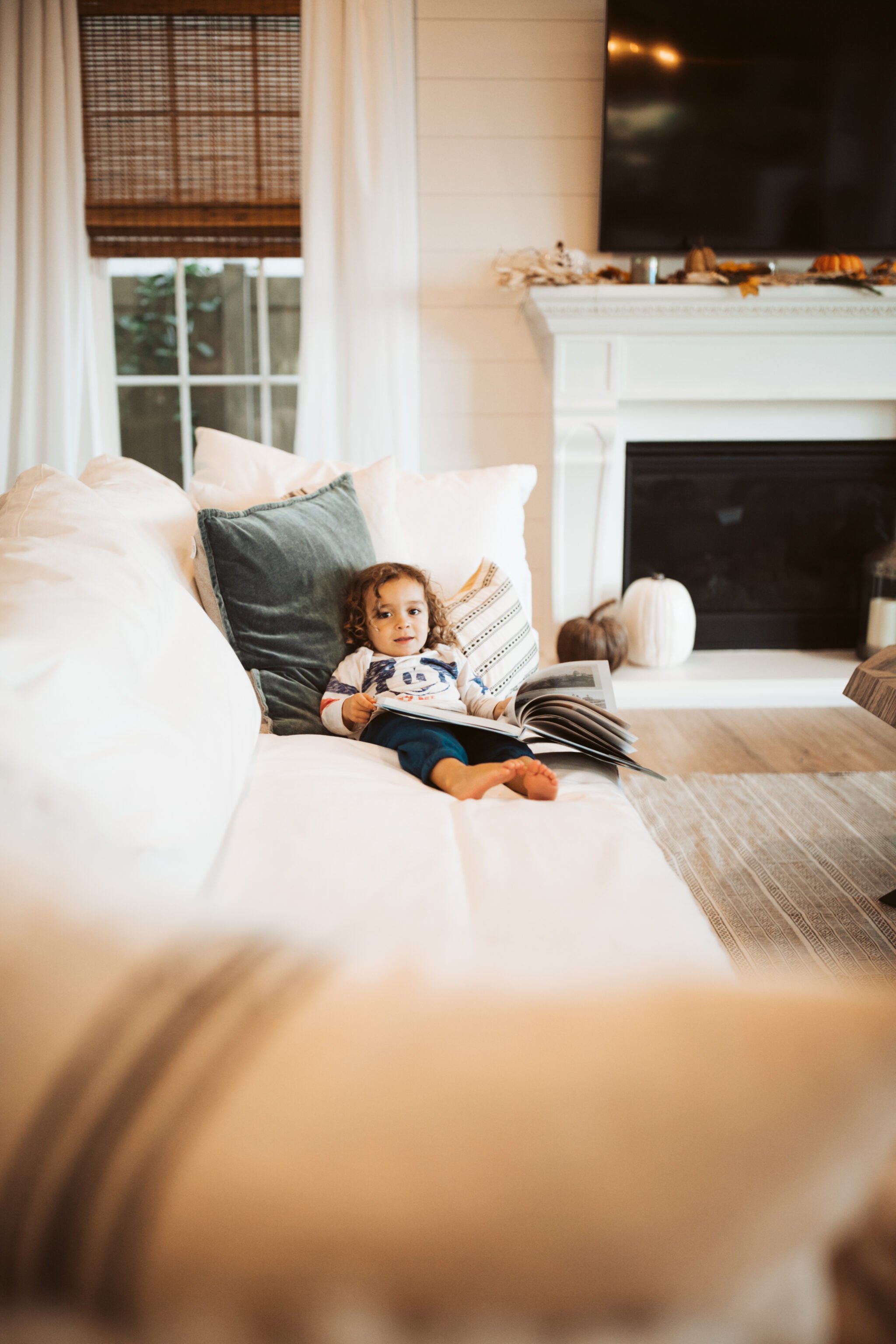 toddler lying on couch