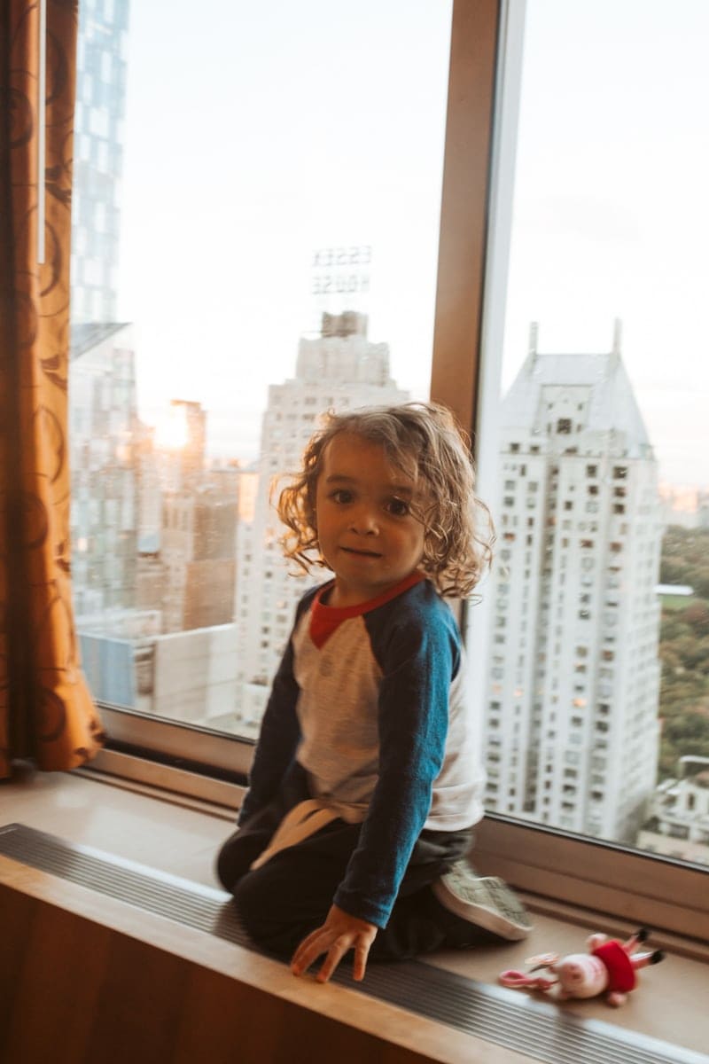 toddler in NYC window