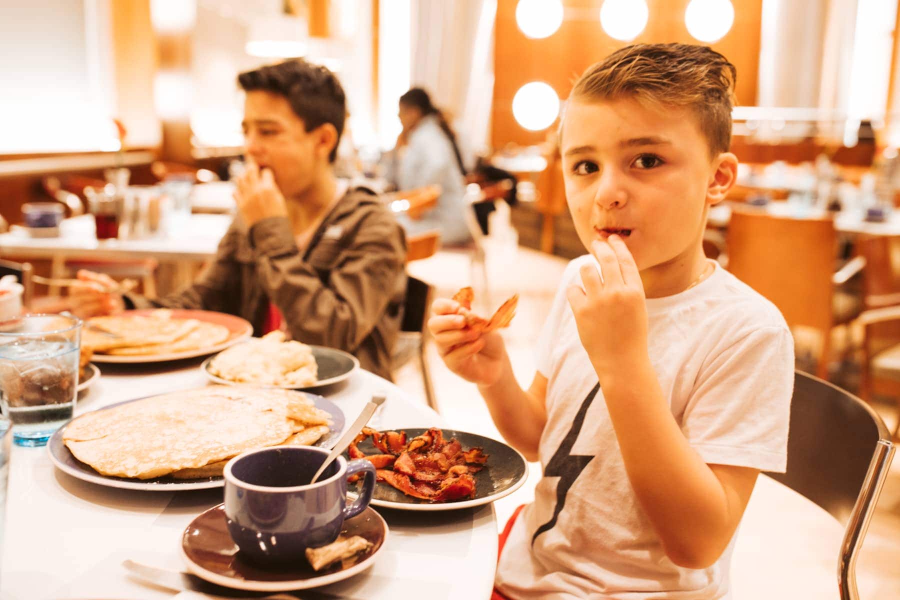 boy eating Normas brunch