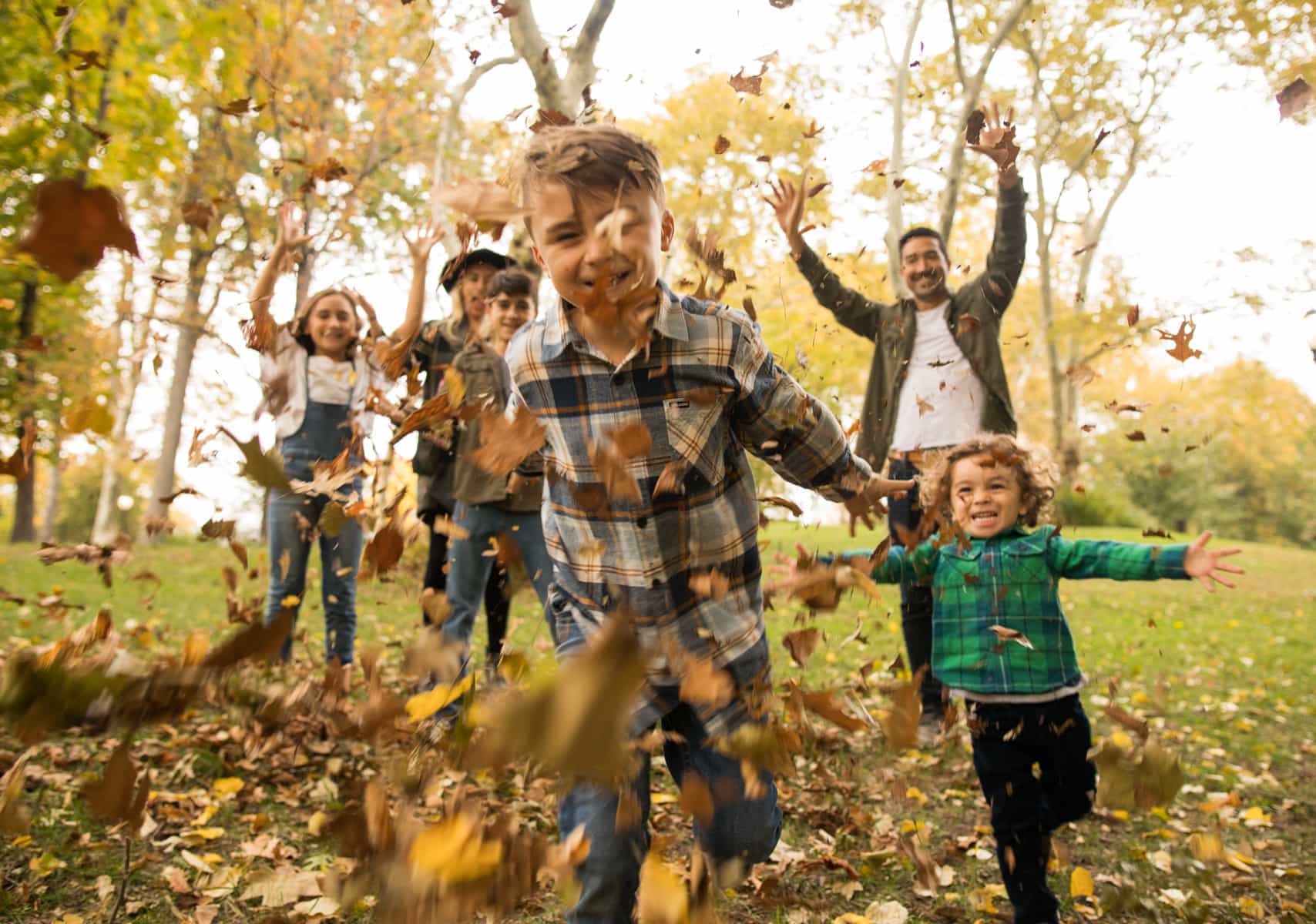 family throwing leaves