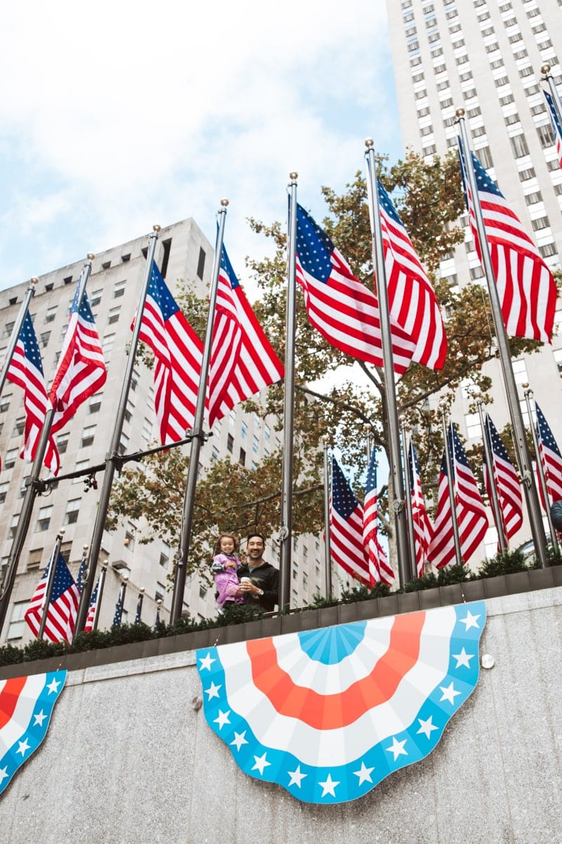 american flags at rockefeller center