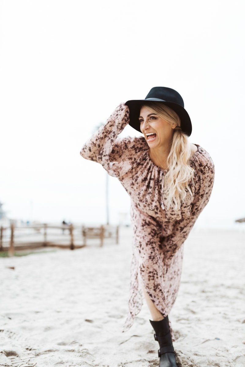 girl in pink dress and black hat