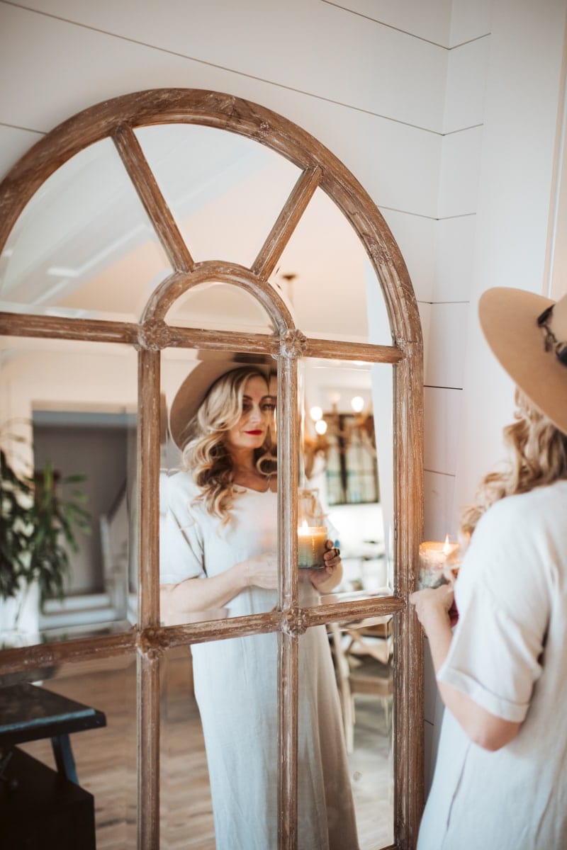 woman in front of mirror