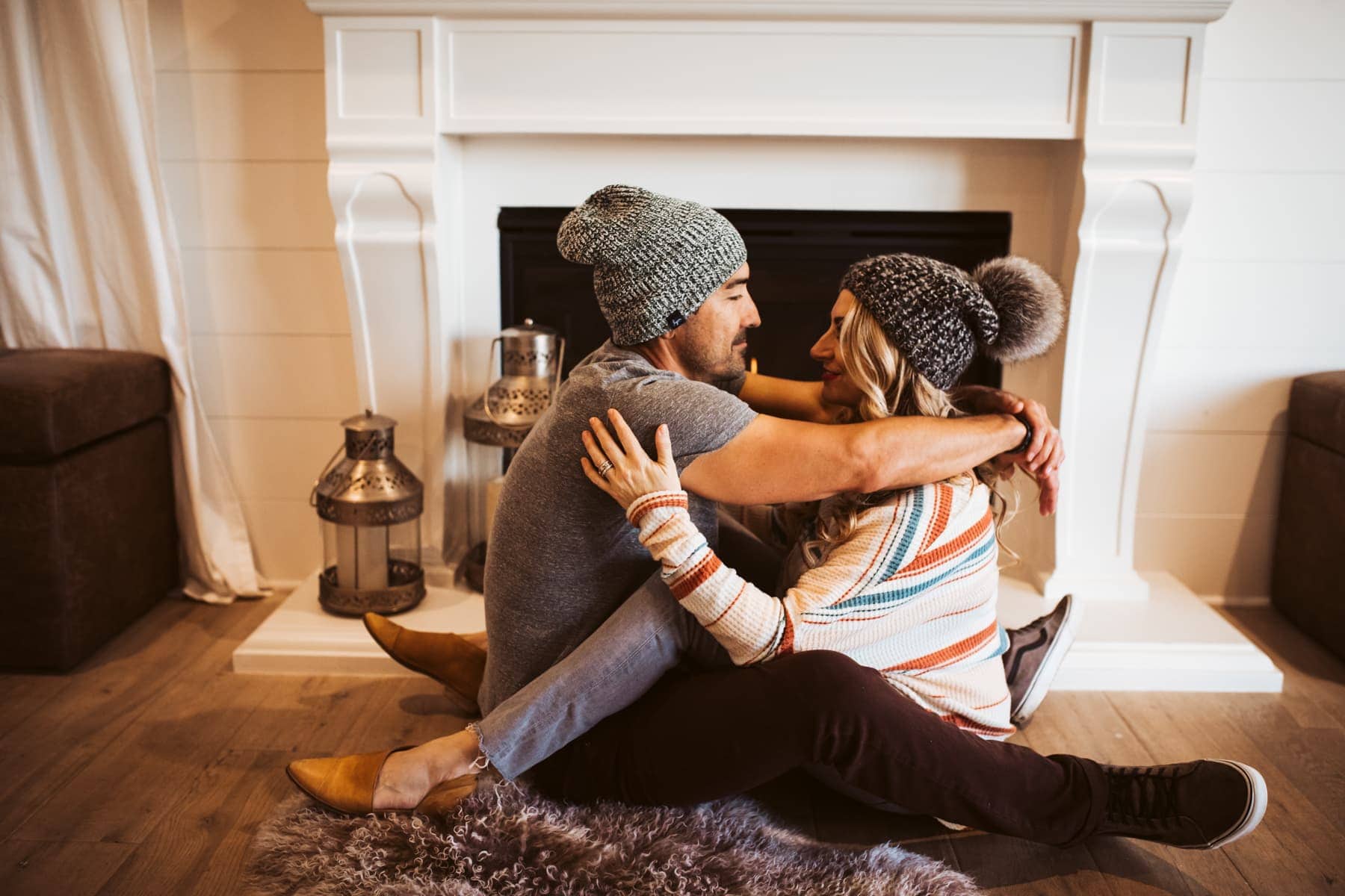 couple by the fireplace