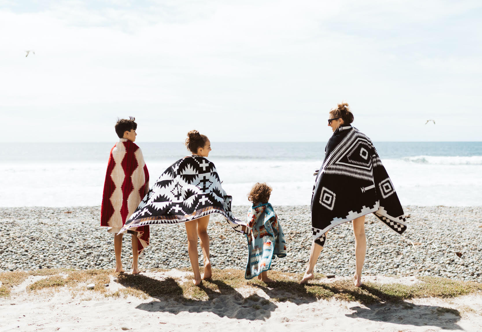 mom with kids at the beach