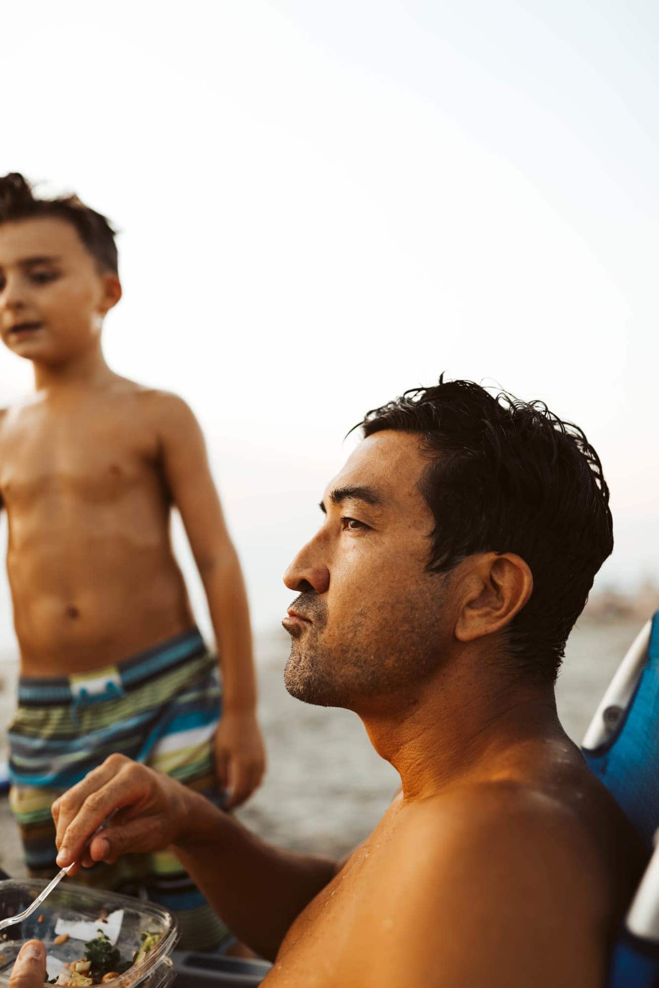 dad and child at the beach