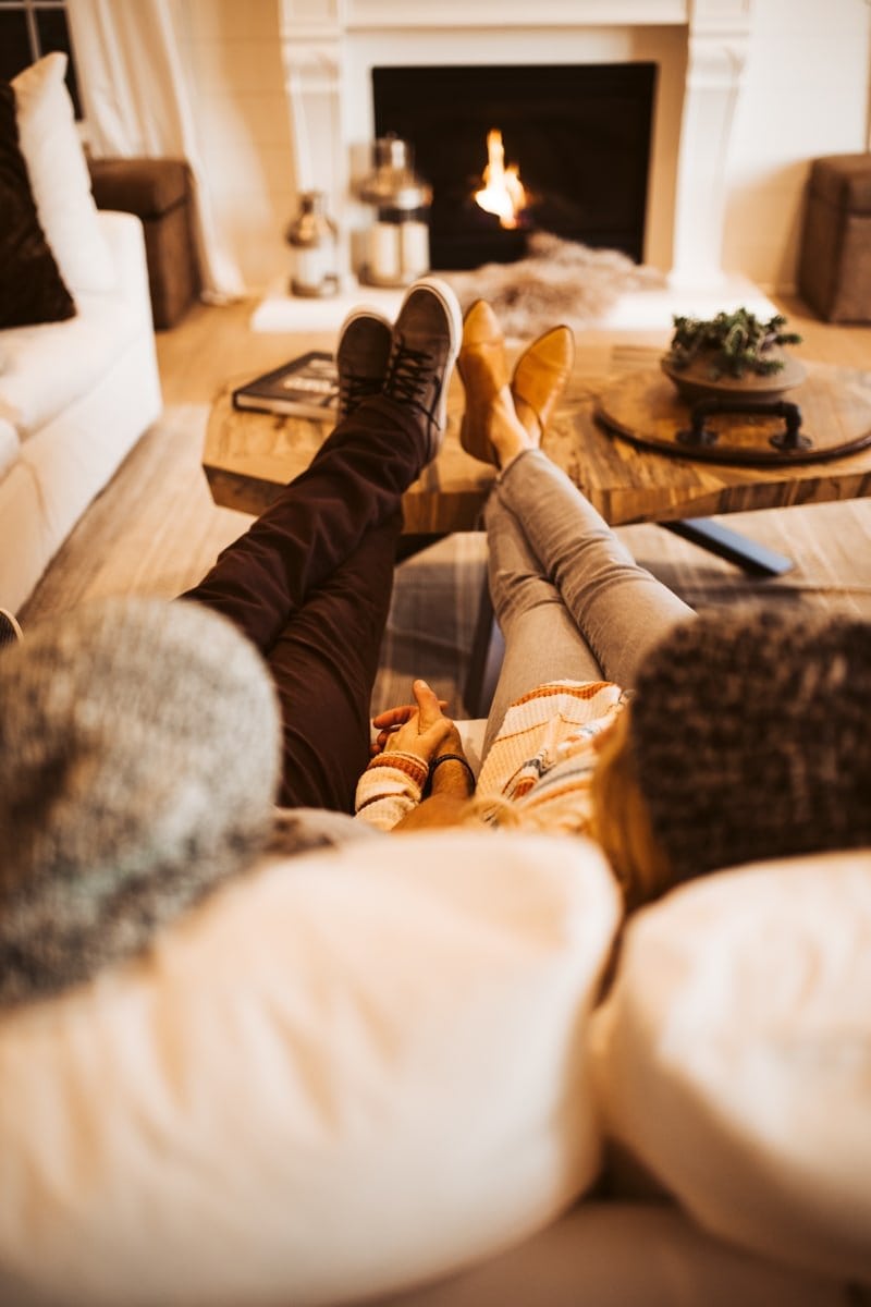 couple by the fireplace