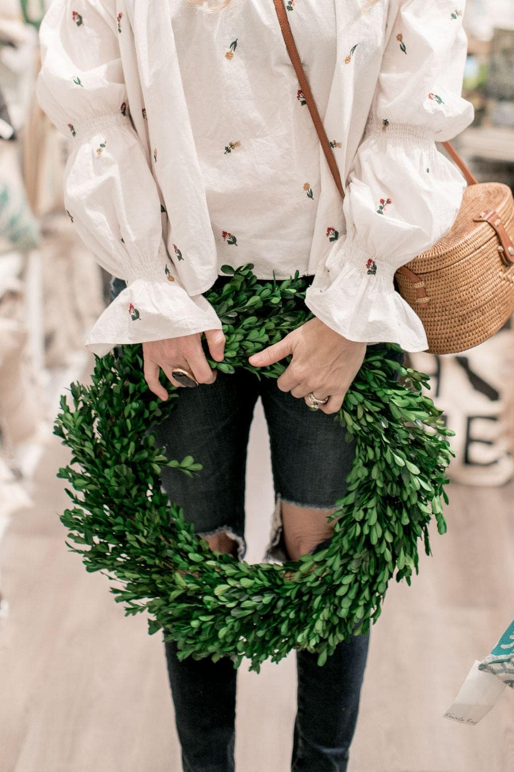 woman holding wreath