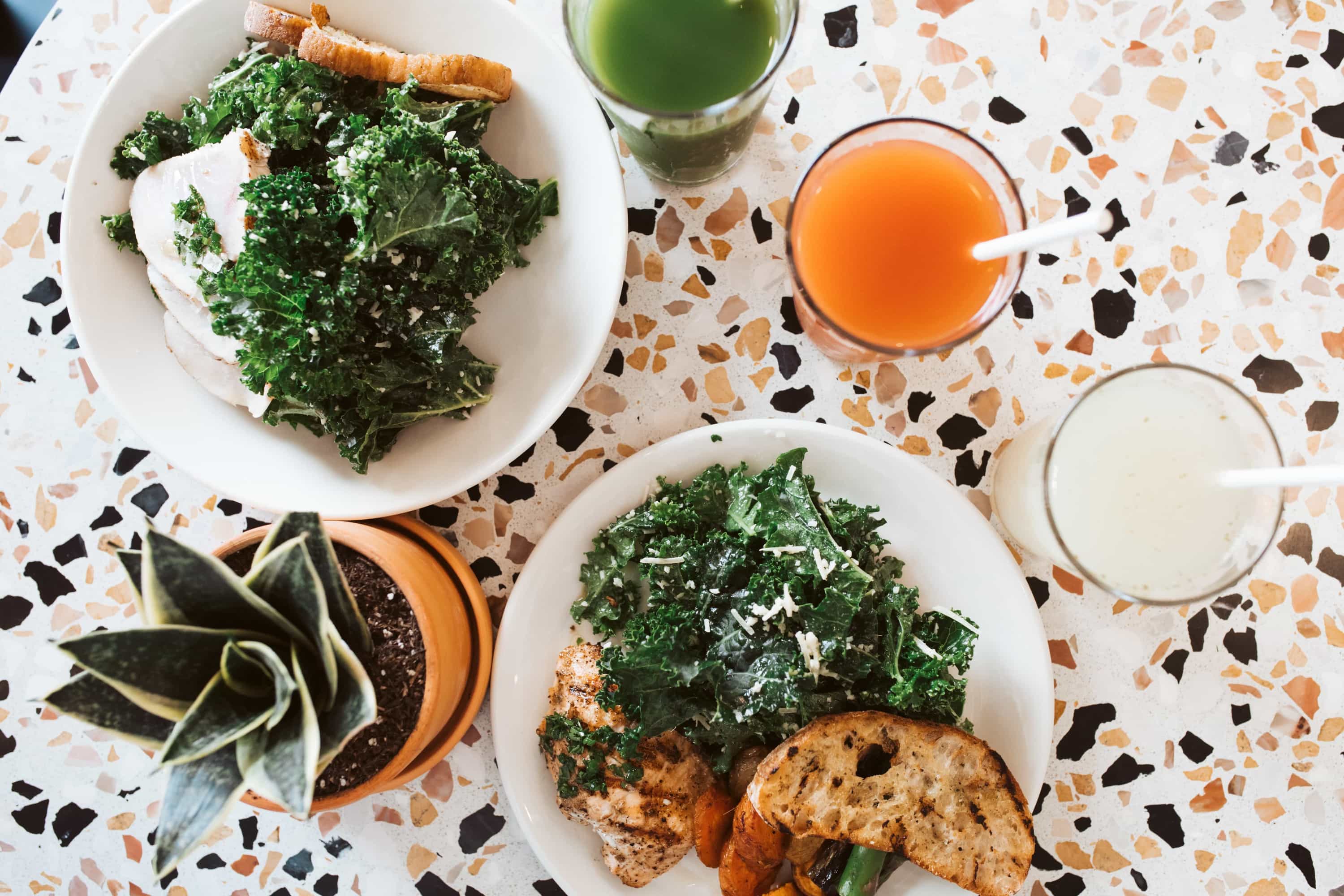 salads and drinks on table