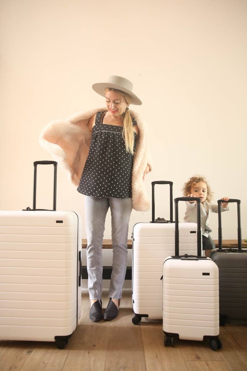 mother and child with luggage