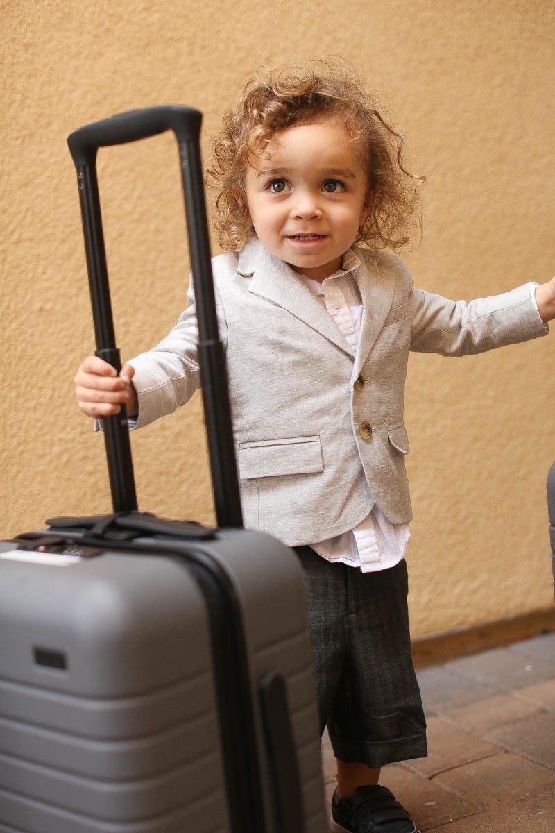 child with luggage