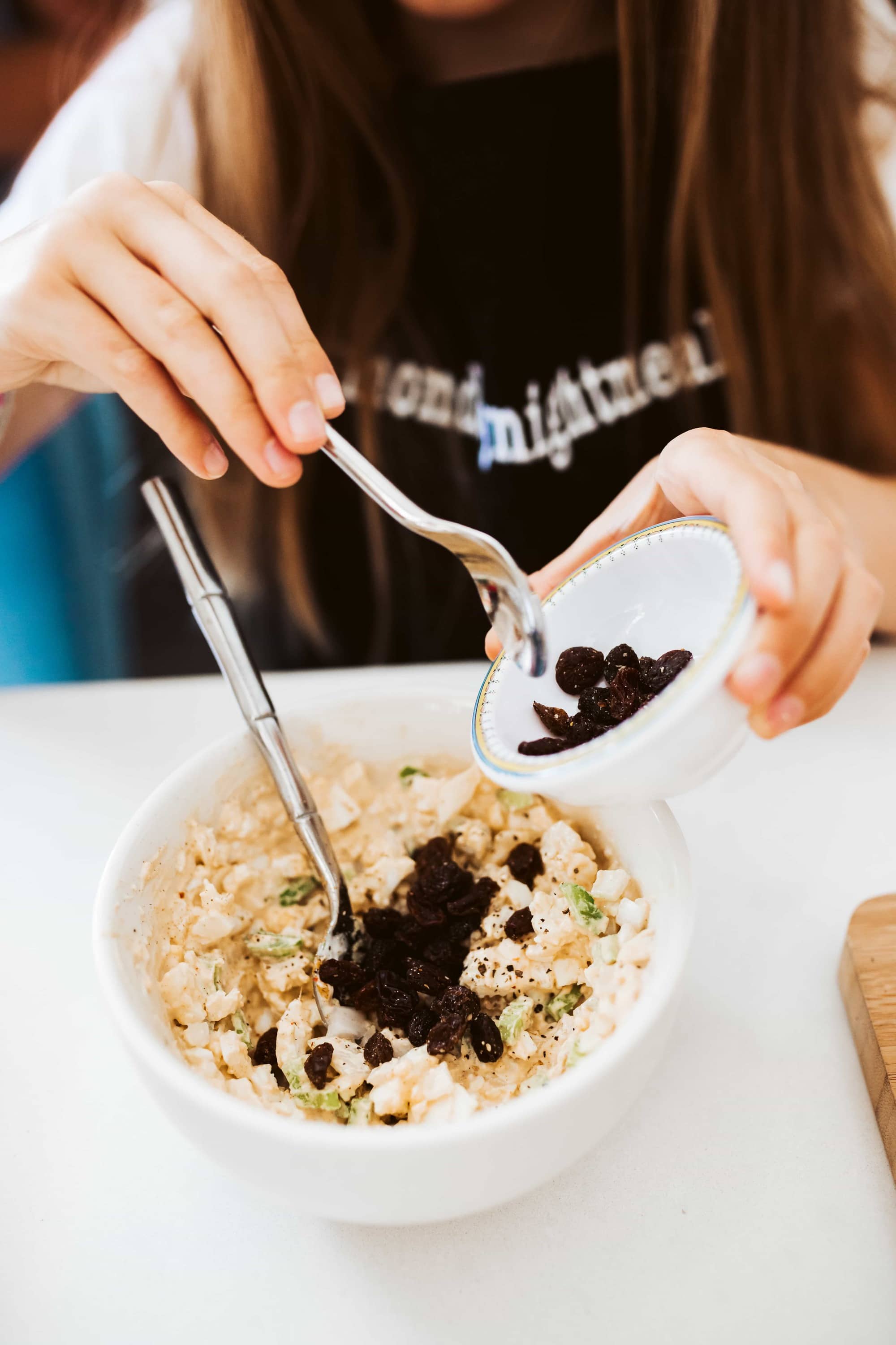 mixing raisins into recipe