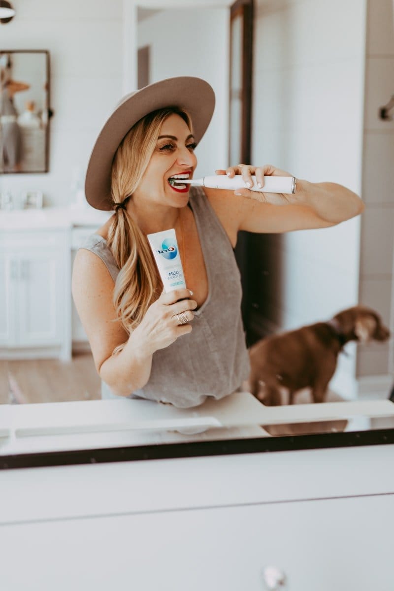 woman brushing her teeth