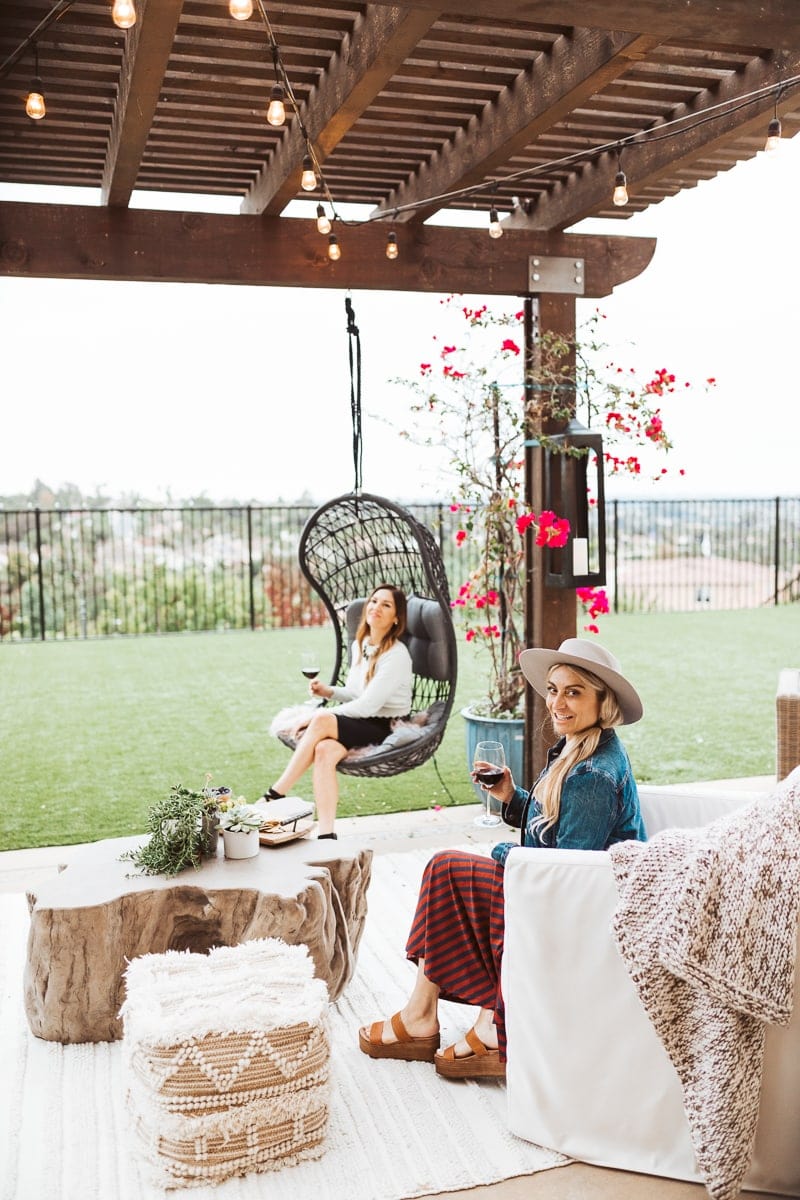 women sitting on patio