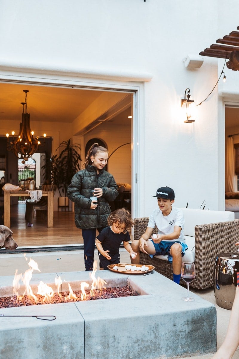 kids around firepit in backyard