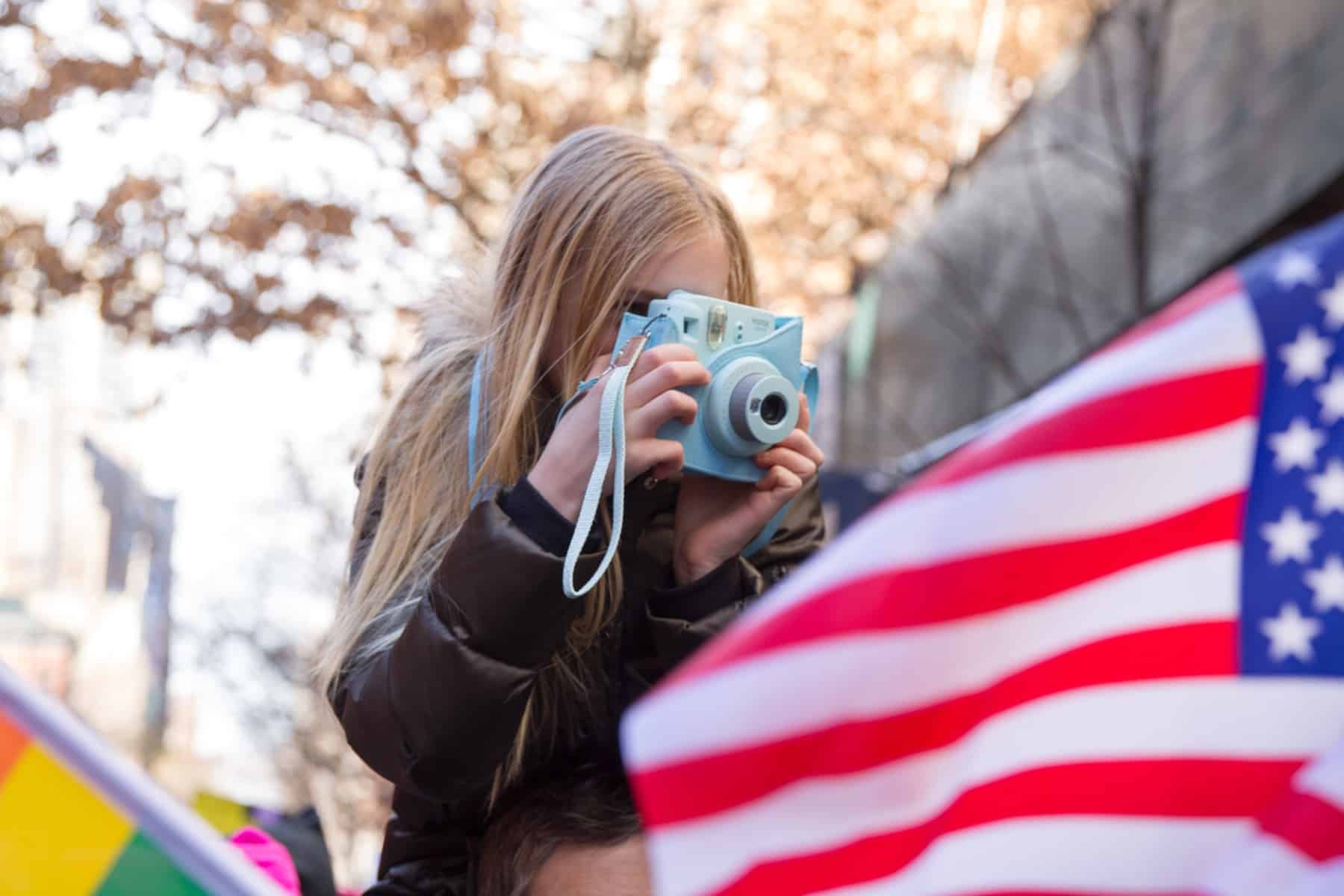 child taking photo