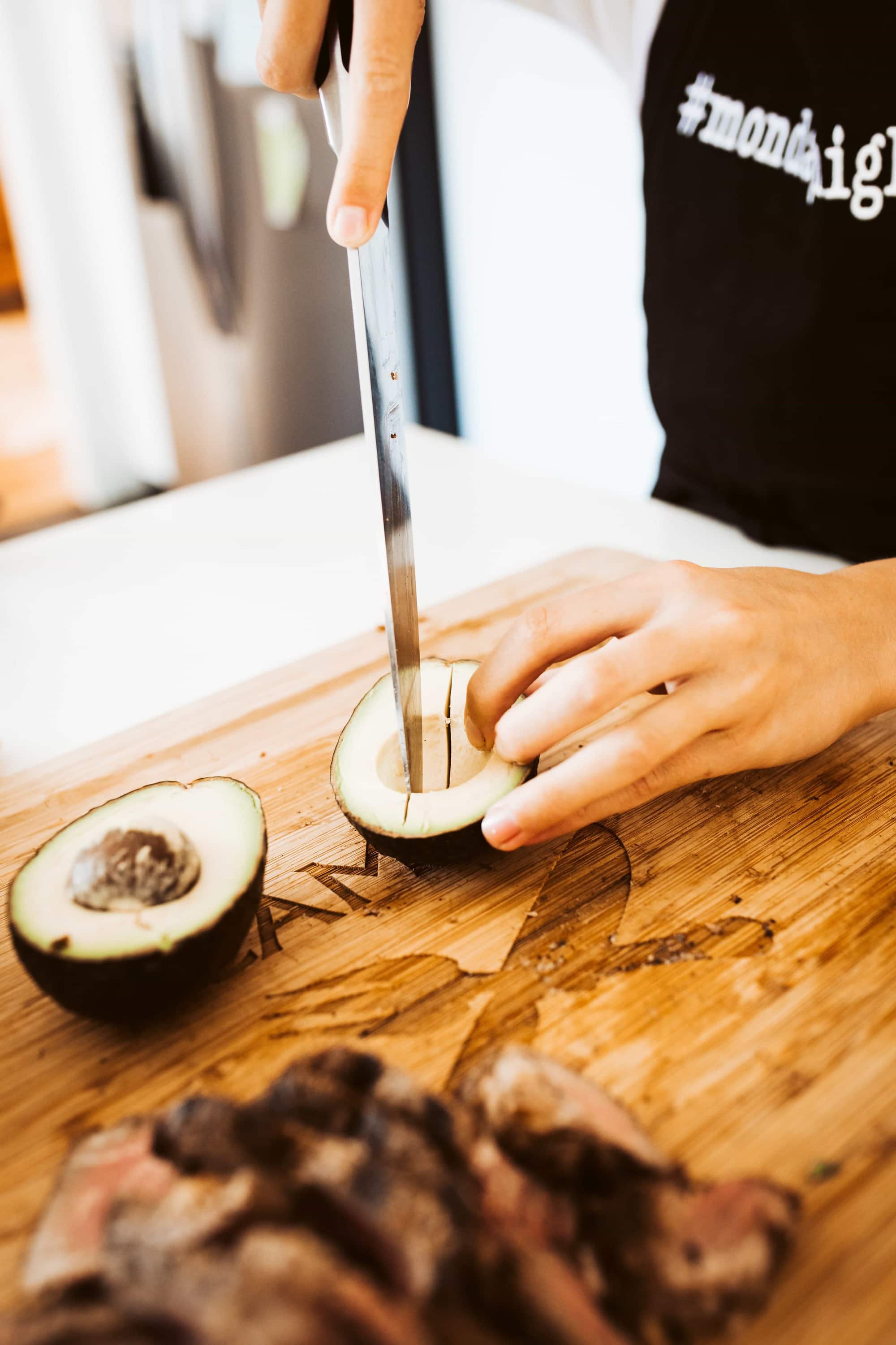 chef slicing avocado