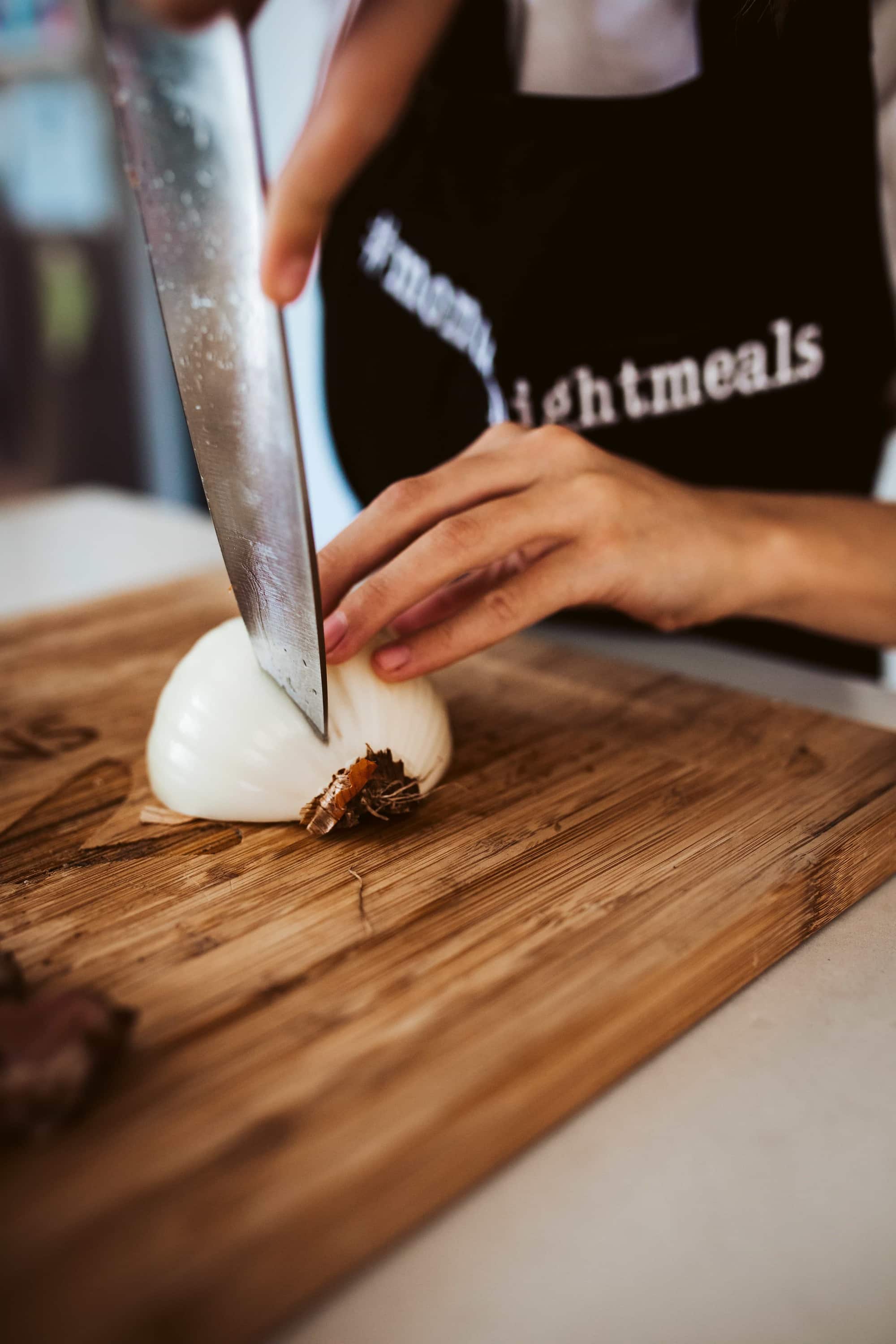 chef chopping onion