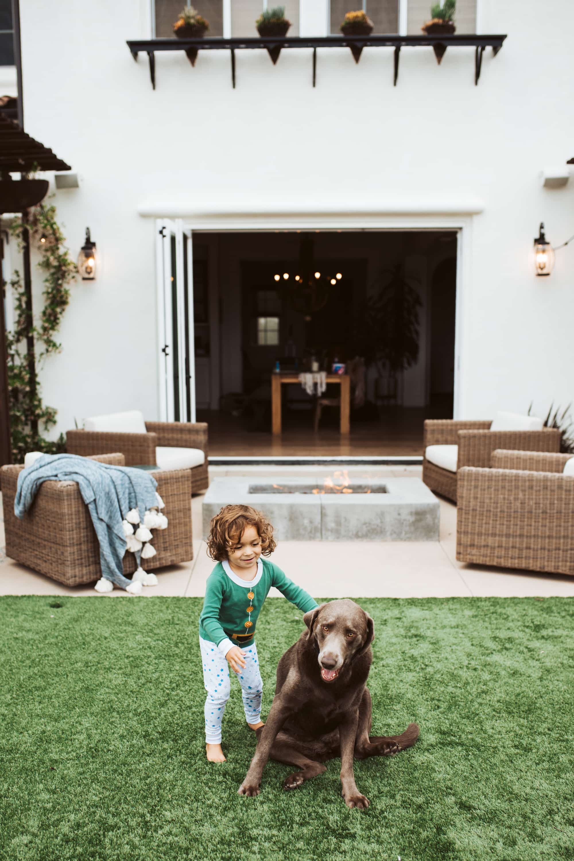 boy and his dog in backyard