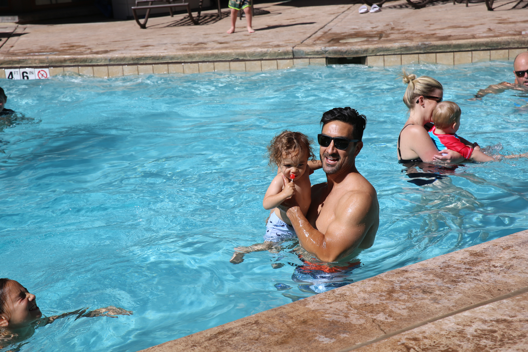 dad and baby in pool