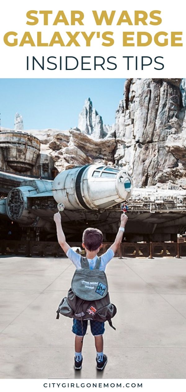 boy in front of millennium falcon