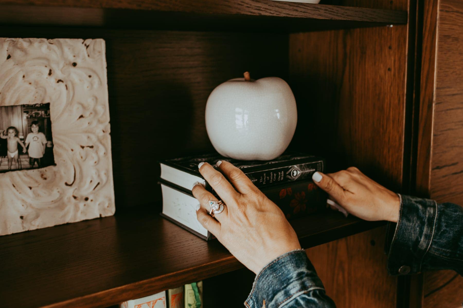 bookshelf hands