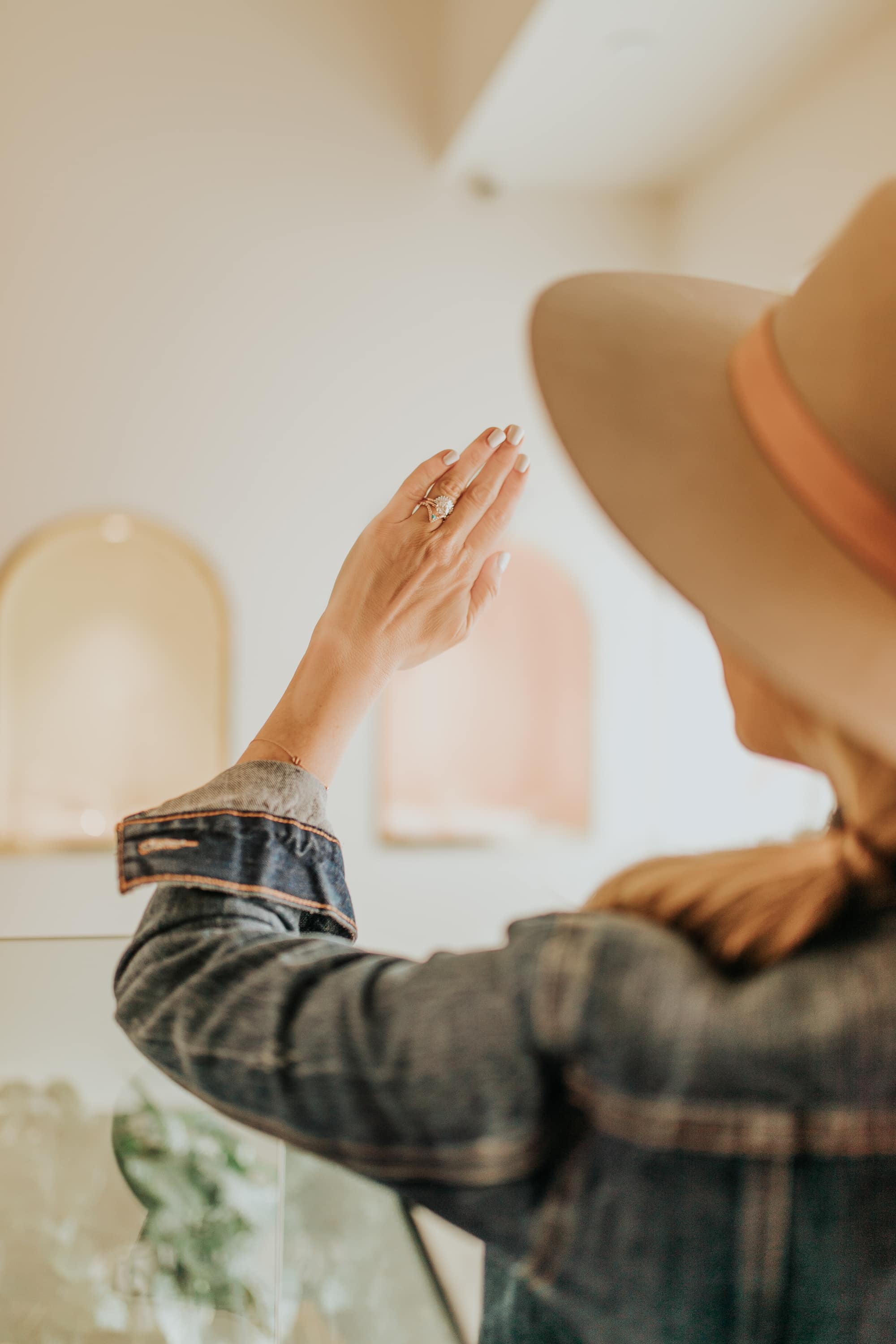 woman looking at engagement ring