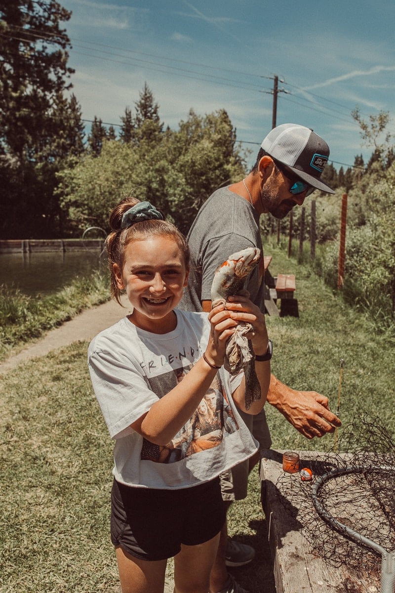 girl catching fish