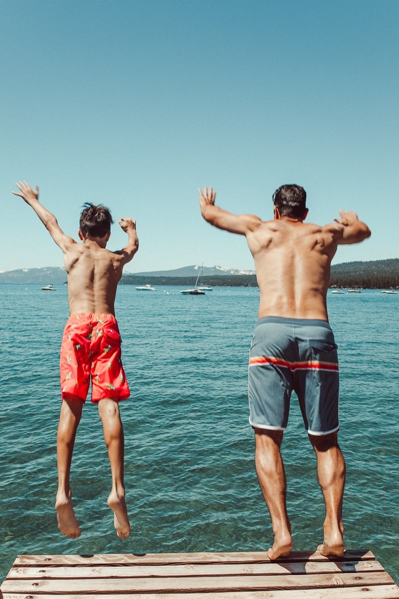 guys jumping in lake