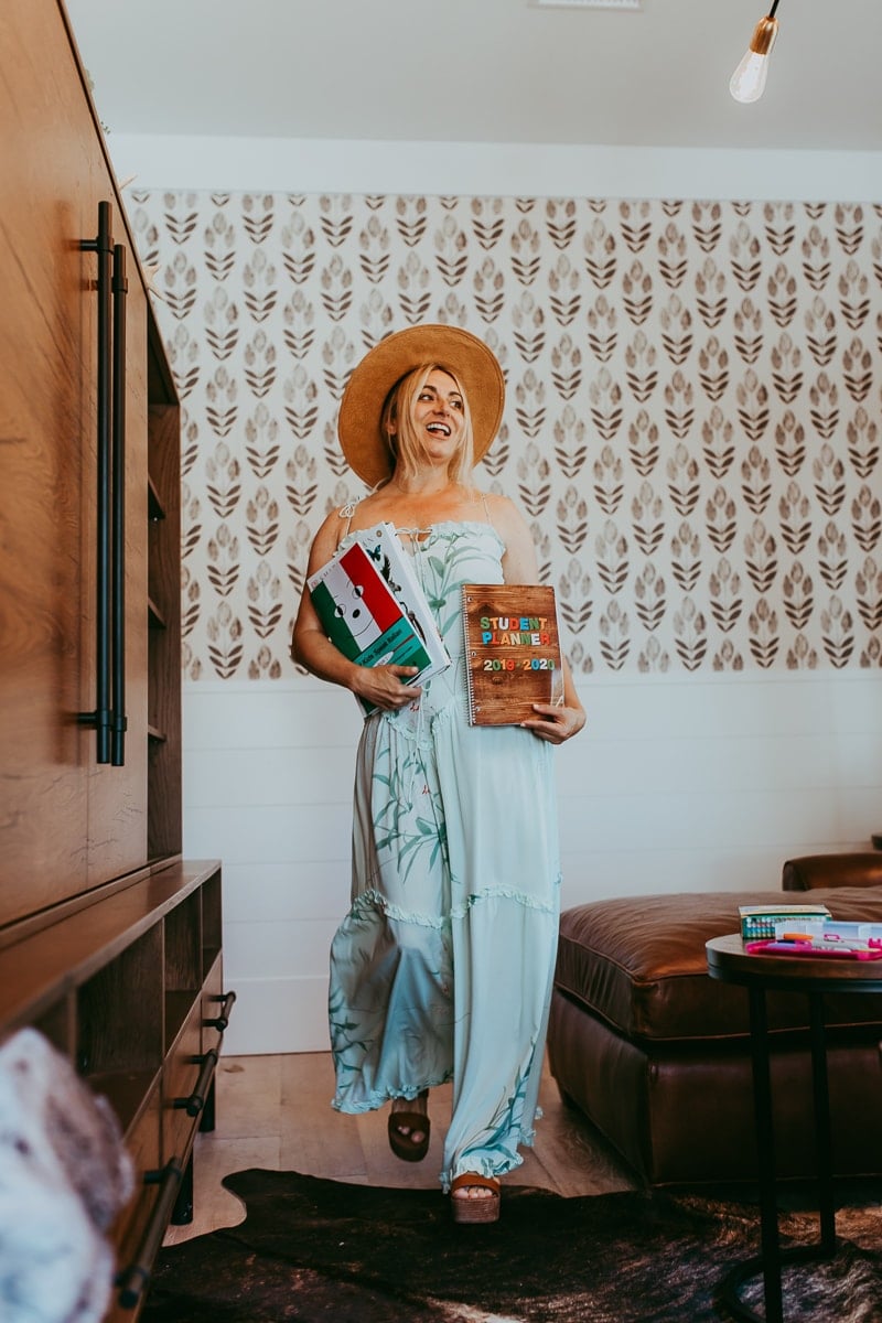 woman holding schoolbooks