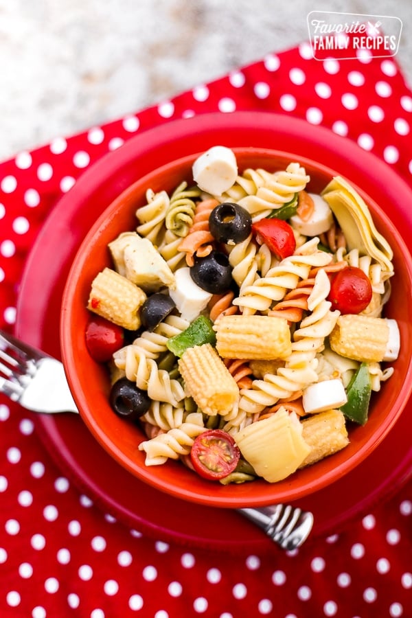 A simple Italian pasta in a red bowl.