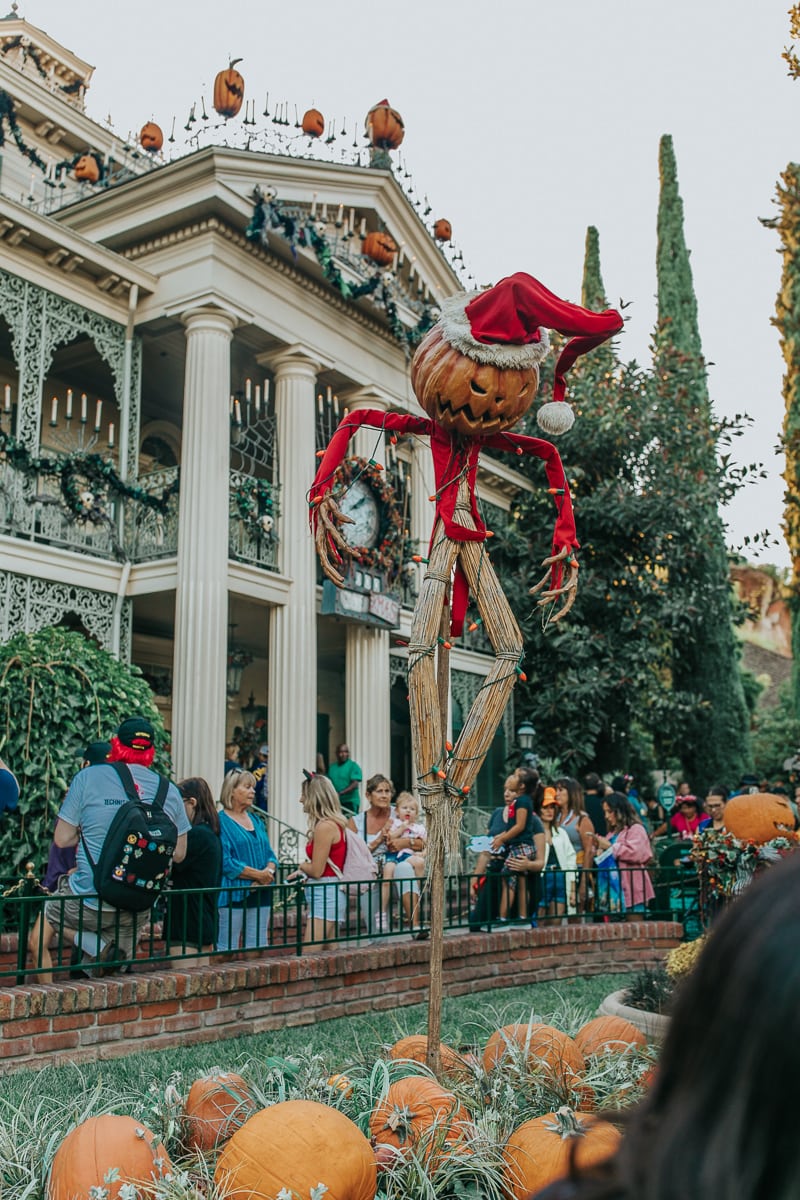Outside Disneyland's the haunted mansion at Halloween.