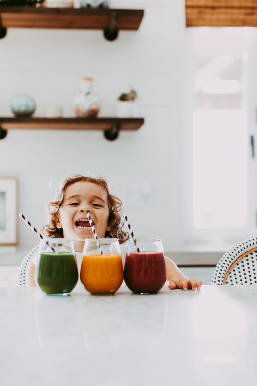 happy toddler with juice