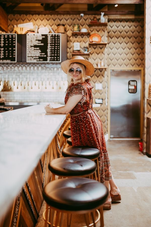 woman standing at bar