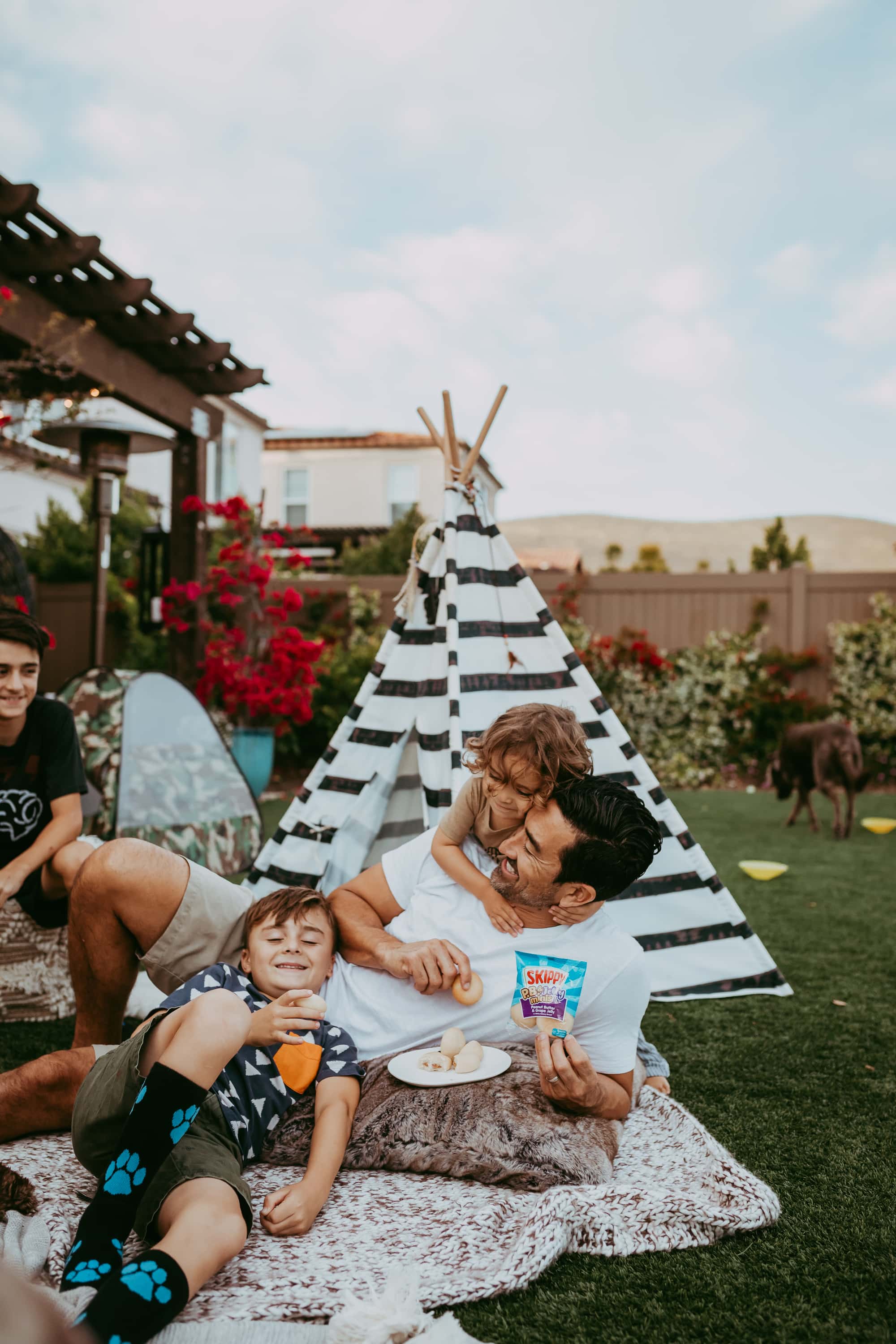 dad in backyard with sons