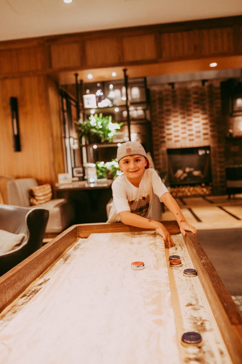 boy playing air hockey