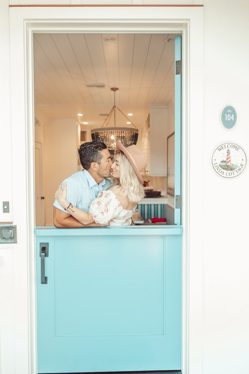 couple kissing in doorway