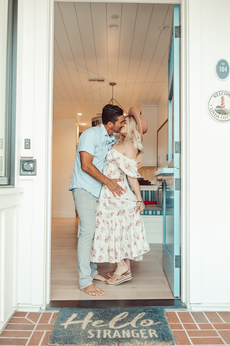 couple kissing in the doorway