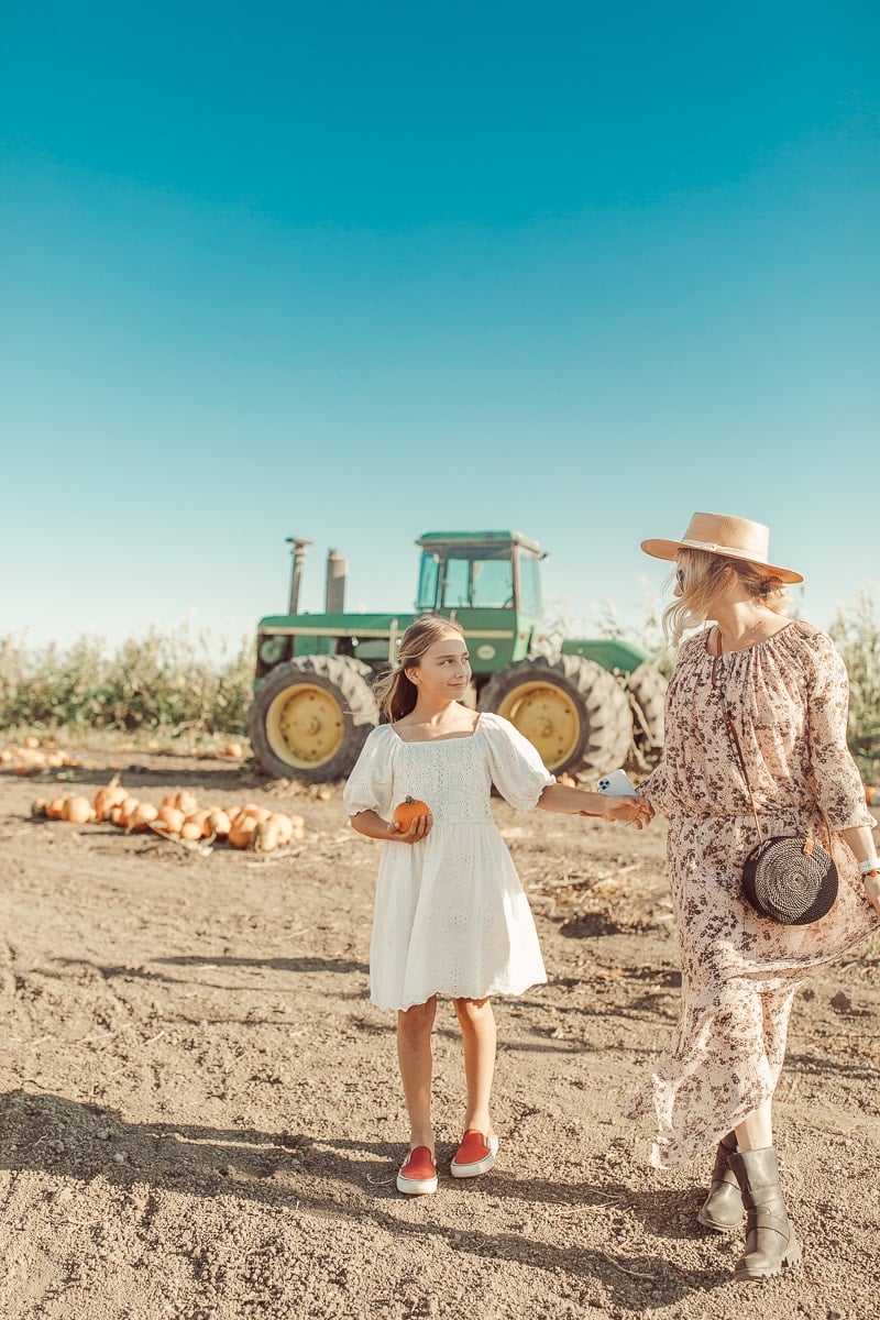 mom and daughter at pumpkin patch