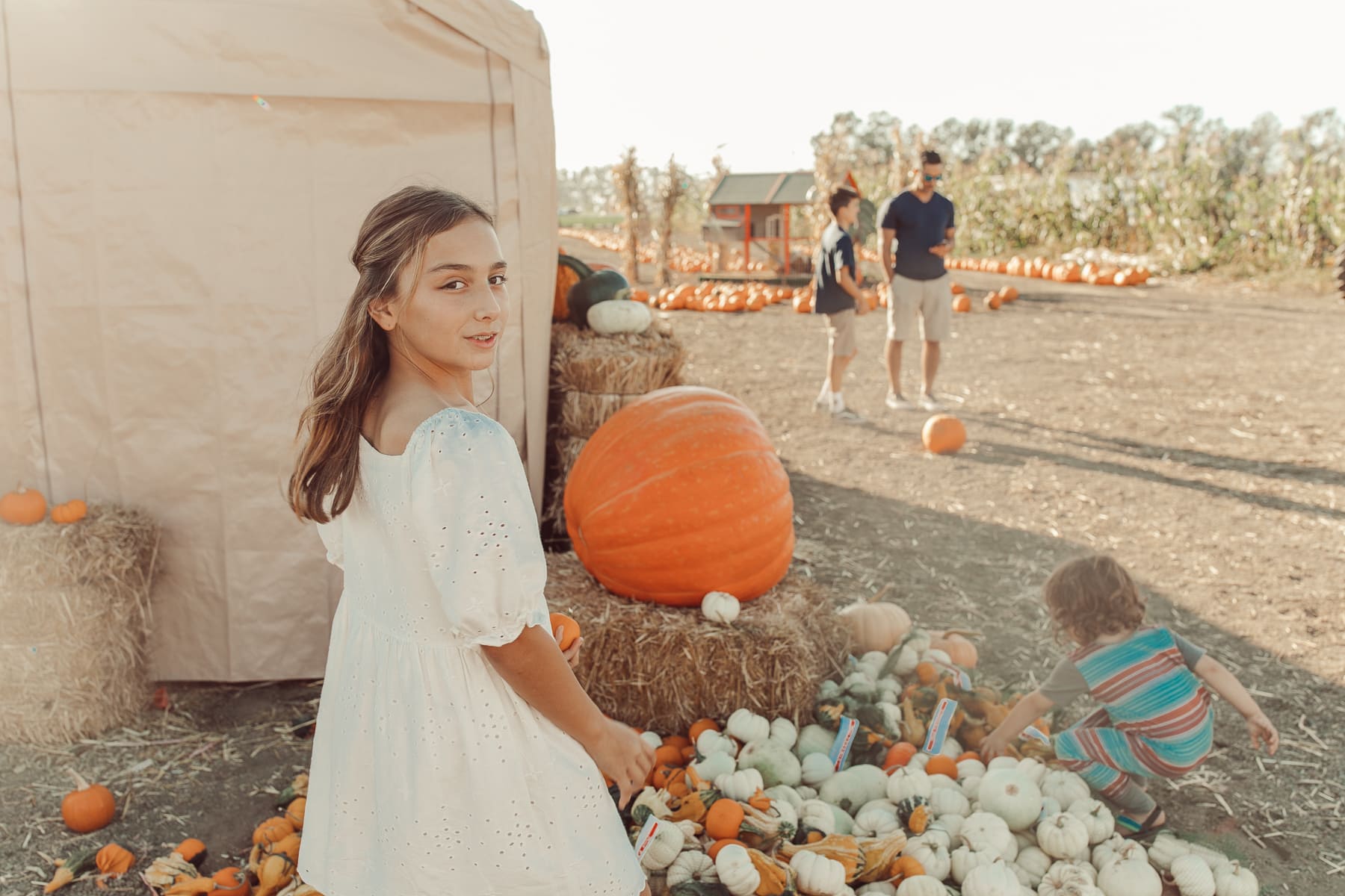 girl in pumpkin patch