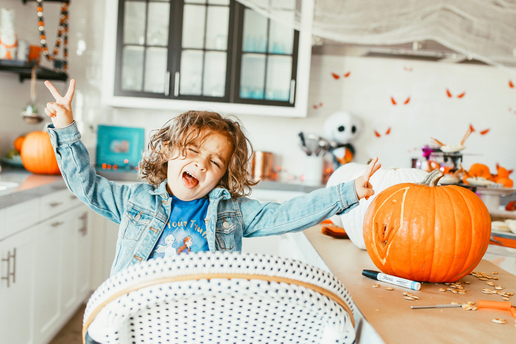 boy dancing near pumpkin