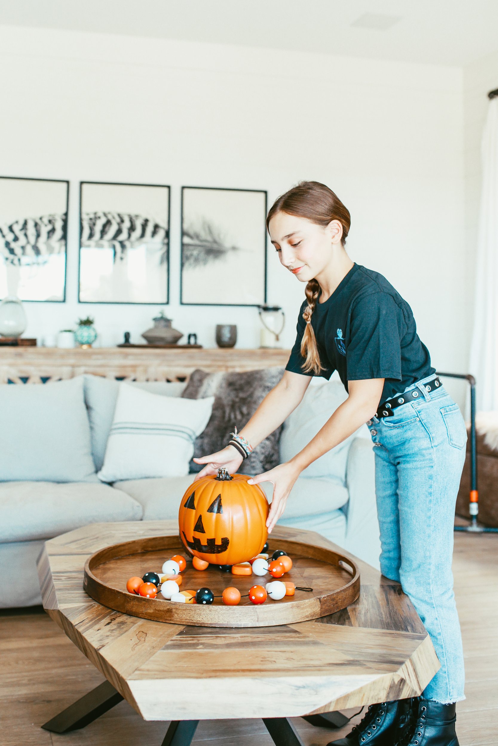 girl holding halloween pumpkin